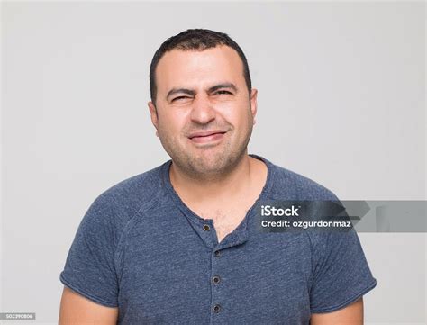 man making  disgusting face expression stock photo  image