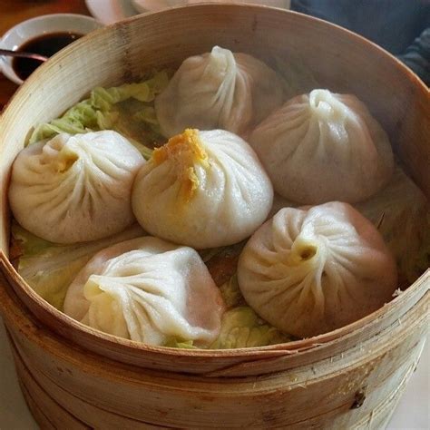 Some Dumplings Are Sitting In A Bamboo Basket