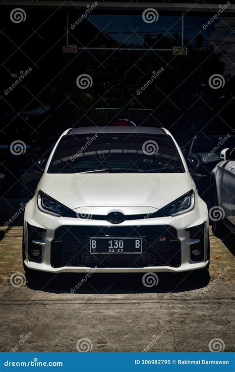 White Toyota GR Yaris GXPA16 Parked On Car Workshop Parking Lot