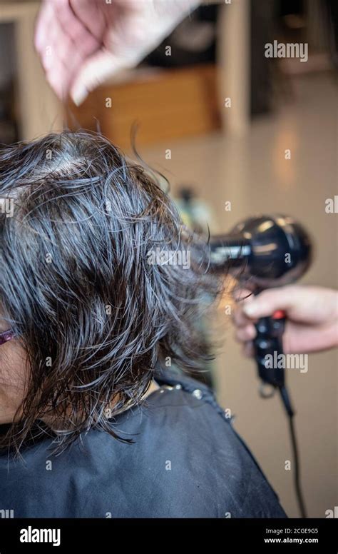 Woman Having A Blow Dry Hi Res Stock Photography And Images Alamy