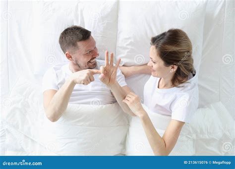 Man Shows Woman Intimate Gestures on Bed Stock Photo - Image of bedroom ...