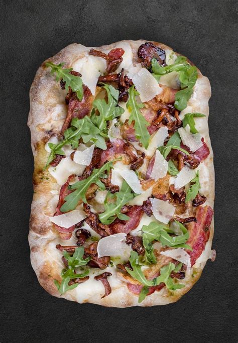 Pizza Carbonara With Bacon Chanterelles Arugula Mozzarella Parmesan