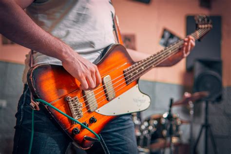 Person Hugging Guitar · Free Stock Photo