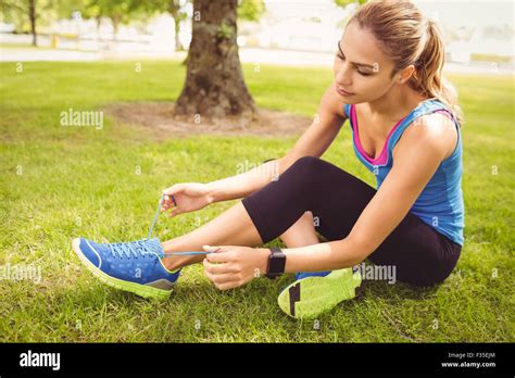 Woman Tying Shoelace Hi Res Stock Photography And Images Alamy