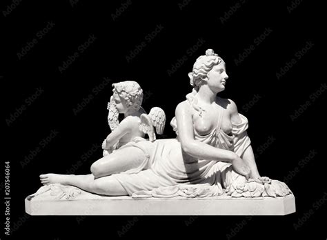 Ancient Greek White Marble Statue Of A Nude Woman And Winged Cupid Isolated On Black Background