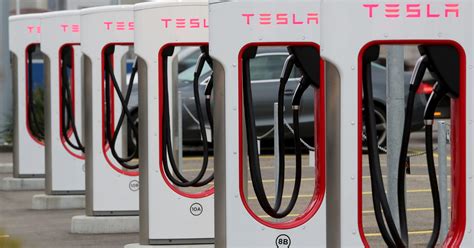 Ford to add more Tesla EV chargers to its network | Reuters