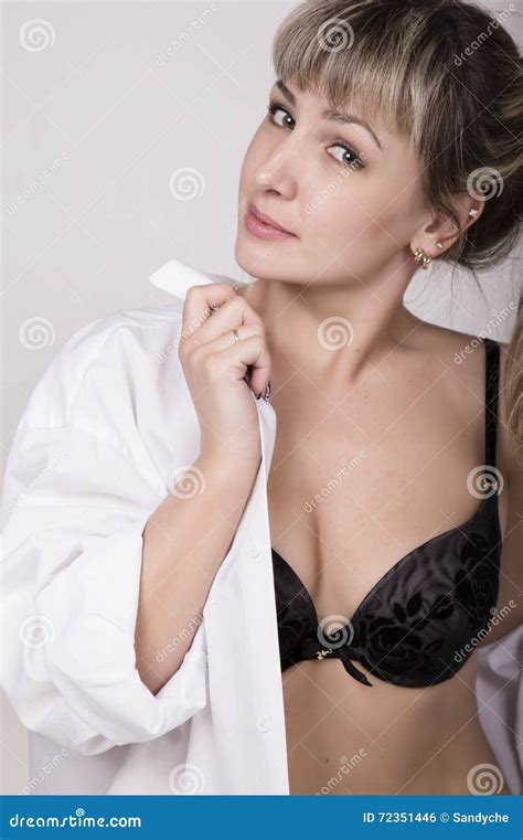 Close Up Portrait Of A Beautiful Woman In A White Shirt Over His Naked Body In Black Lace