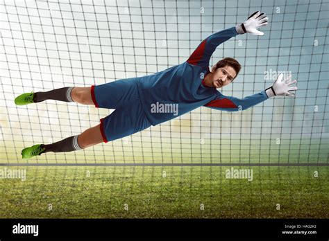 Image Of Goalkeeper Catch Ball In Front Of Goalpost Stock Photo Alamy