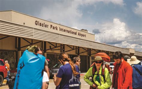 Travelers exit Glacier Park International Airport on July 19, 2019 ...