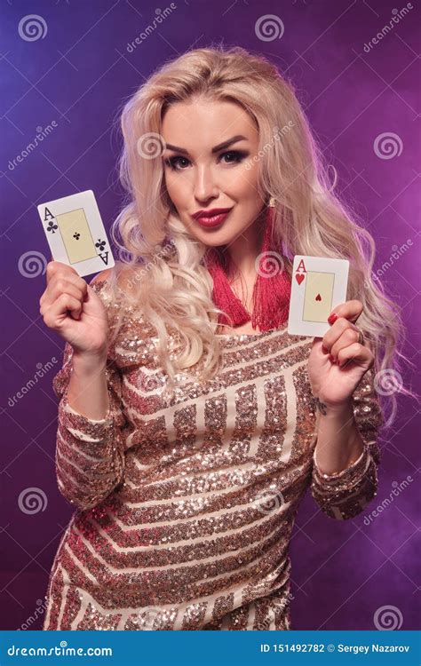 Blonde Woman With A Perfect Hairstyle And Bright Make Up Is Posing With Playing Cards In Her