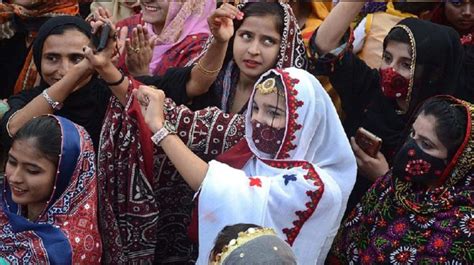 Men And Women Celebrate Sindhi Culture Day With Singing And Dancing