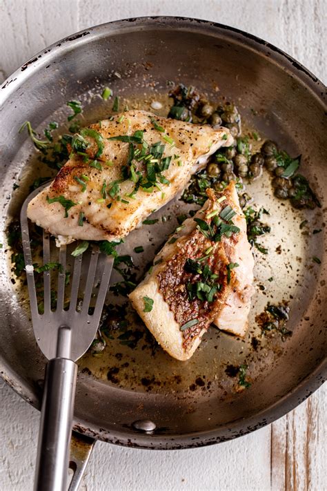 Pan Seared White Fish Cooking With Cocktail Rings