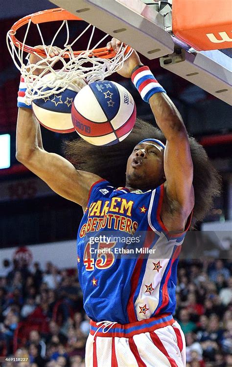 Alexander "Moose" Weekes of the Harlem Globetrotters dunks two... News ...