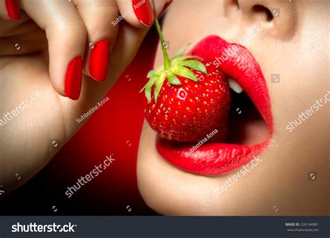 Sexy Woman Eating Strawberry Sensual Red Lips Red Manicure And