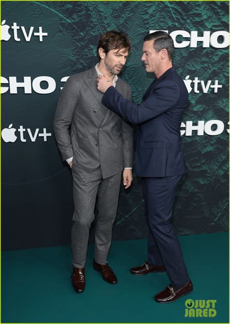 Luke Evans Fixes Michiel Huisman S Shirt At Echo Series Premiere