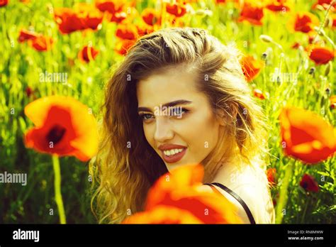 Pretty Woman Or Happy Girl In Field Of Poppy Seed Stock Photo Alamy