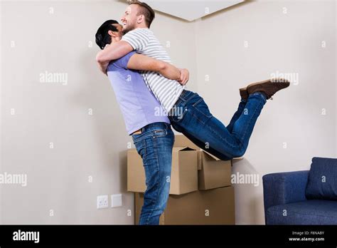 Gay Couple Moving Into New Home Stock Photo Alamy