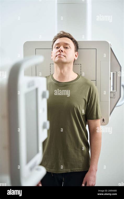 Man Undergoing Chest Radiography In Anteroposterior Projection Stock