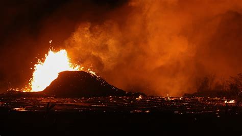 'Eerie' blue flames burn in cracks caused by Hawaii volcano