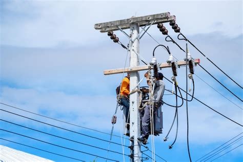 Premium Photo Electrician Lineman Repairman Workers Climbing On