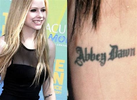 Avril Lavigne's 19 Tattoos & Their Meanings - Body Art Guru