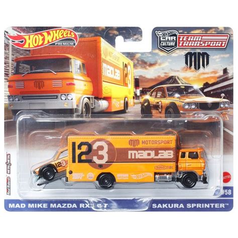 Hot Wheels Team Transport Fahrzeuge Truck mit Anhänger und Race Car Mad ...
