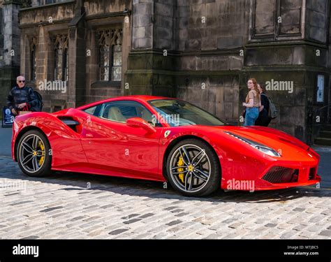 people  enviously   bright red ferrari  gtb coupe sports car
