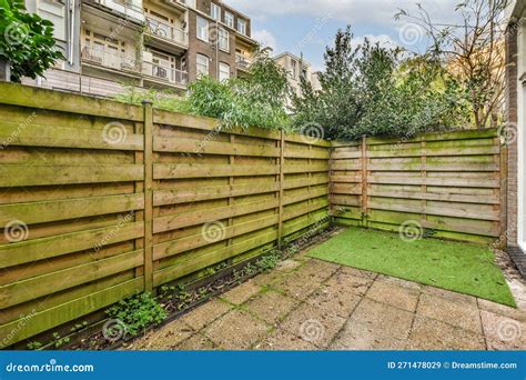 A Wooden Fence In A Backyard With Green Grass Stock Image Image Of