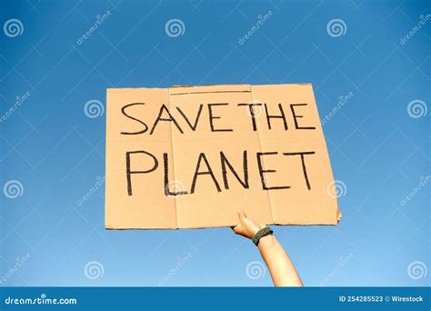 Cardboard Sign Saying Save The Planet Held By Two Hands On Clear Sky