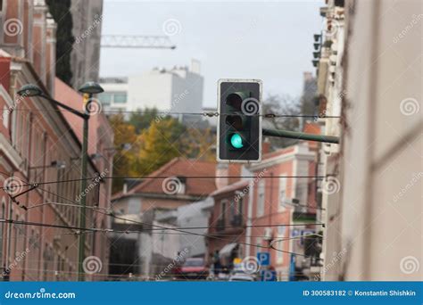 Traffic Light Hanging from Building Stock Photo - Image of hanging, green: 300583182