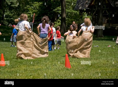 Children Having Sack Race In The Park Stock Photo Alamy