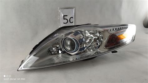 FORD MONDEO MK4 REFLEKTOR LEWY SOCZEWKA LAMPA LEWA 7S71 13008 AG Za 900