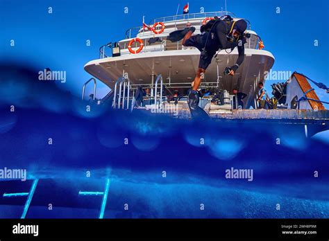 The Beauty Of The Underwater World Diver Jumping From Boat Into Water