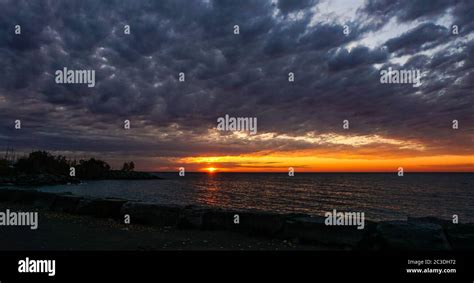 Sunrise over a cloudy sky at the Scarborough Bluffs Park in Toronto ...