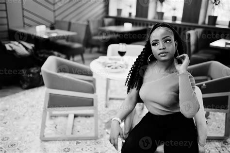 Portrait of attractive young african american woman wearing in green ...