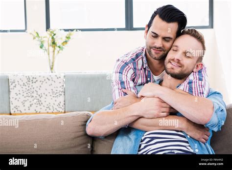Gay Couple Relaxing On The Couch Stock Photo Alamy