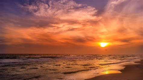 Ocean Waves Beach Sand Under White Clouds Blue Sky During Sunset Hd