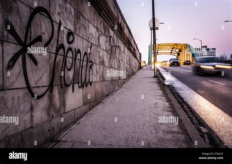 Graffiti On A Wall And Traffic Moving Over The Howard Street Bridge In