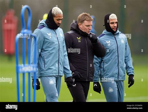 Newcastle United Manager Eddie Howe With Bruno Guimaraes Right And Joelinton Left During A