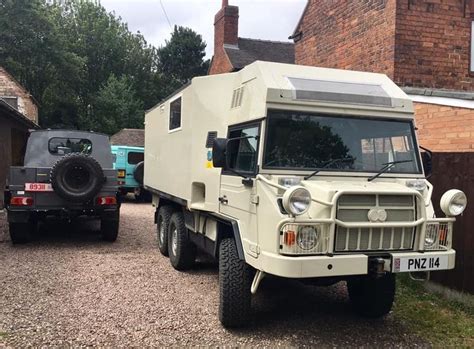 An Armored Vehicle Parked In Front Of A House