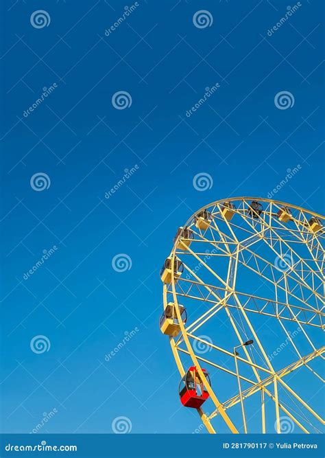 Ferris Wheel in an Amusement Park. Copy Space. Entertainment and Fun