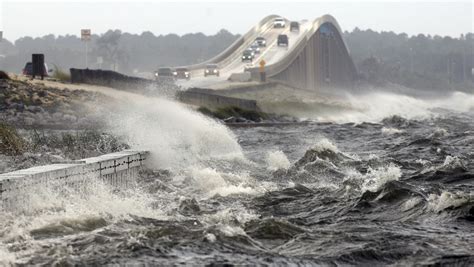 Storm surge warnings: Life-threatening, will cover a house