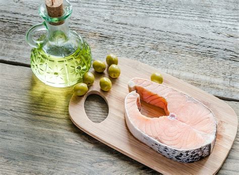 Premium Photo | Food with unsaturated fats - salmon and olive oil