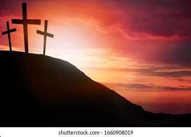 Silhouette Cross On Calvary Mountain Sunset Stock Photo