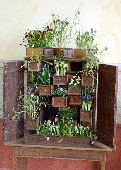 An Old Wooden Box Filled With Plants And Flowers