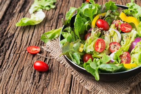 fresh vegetable salad   wooden background stock image image