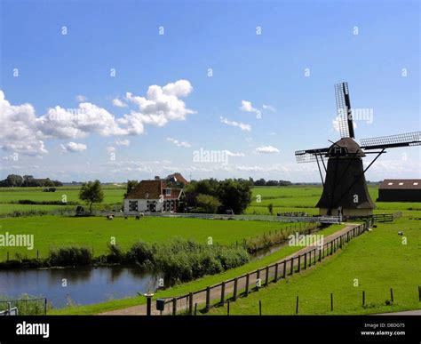 the netherlands landscape sky clouds windmill Stock Photo - Alamy