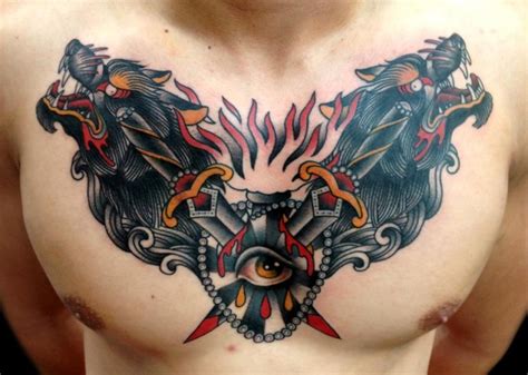 Old school painted and colored hell dogs tattoo on chest combined with crossed swords and bloody ...