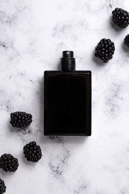 Premium Photo Black Perfume Bottle With Blackberries Concept Of