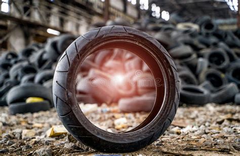 Stack Of Old Black Tires Lying On The Abandoned Plant Landfill Of Used